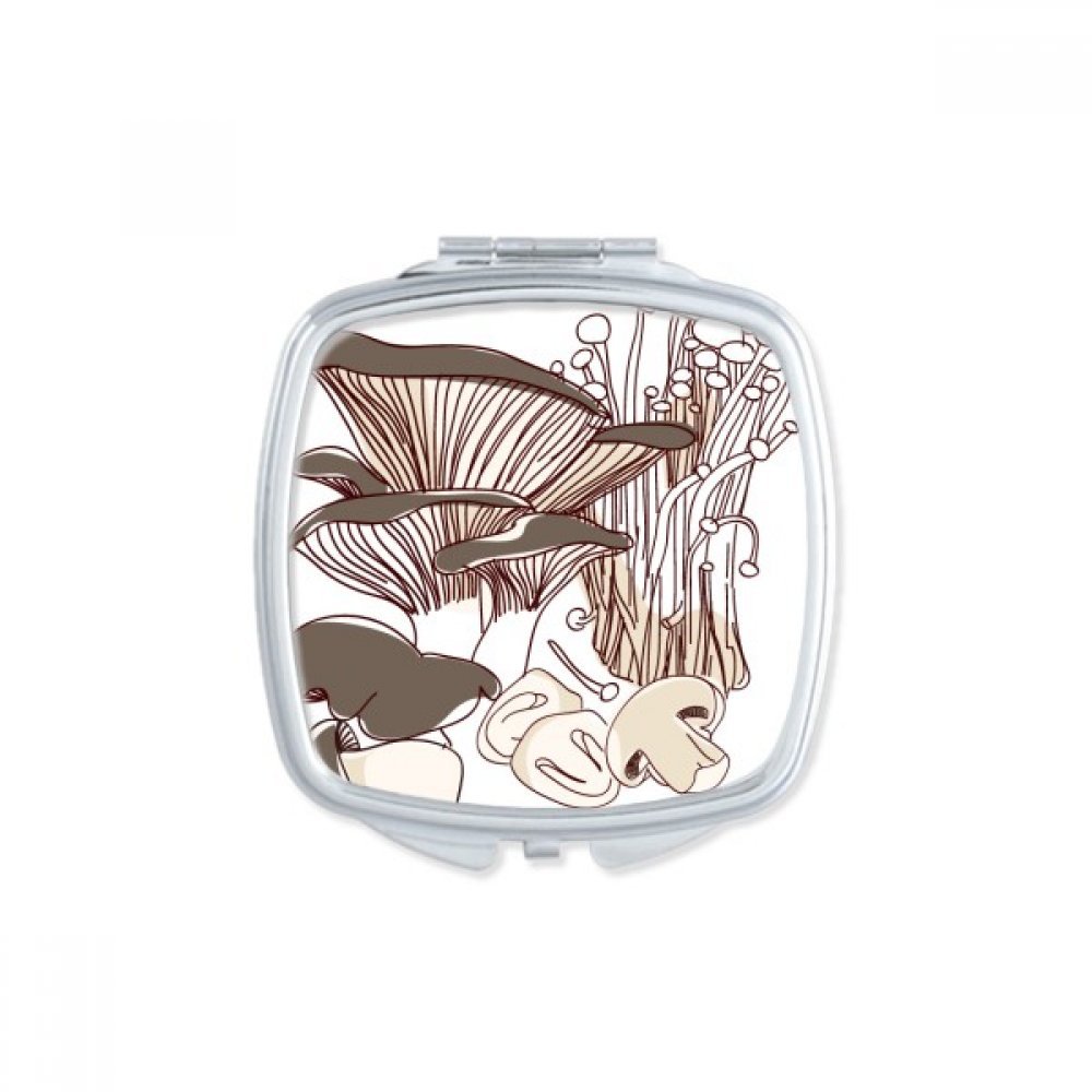 Miroir de poche à la main pour retouches maquillage en voyage