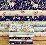 Paquete de tela multicolor de unicornios arcoíris nubes helados