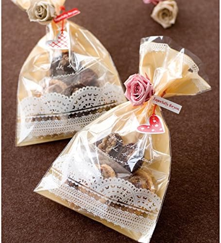 Two HEADS RO-O1 wrapping bags filled with treats, tied with ribbons and small decorative roses