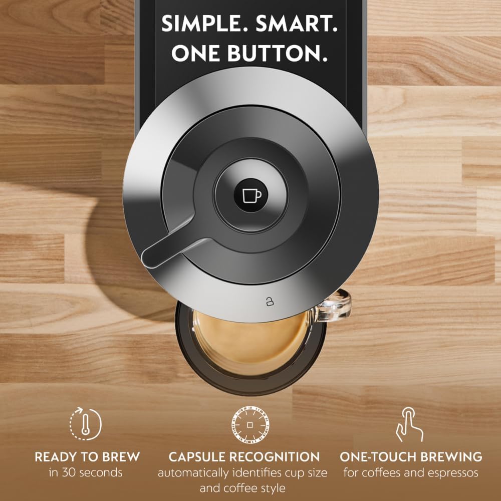 ટોપ-ડાઉન view of the Nespresso Vertuo Next machine's brew head, highlighting the one-button operation and capsule recognition feature.