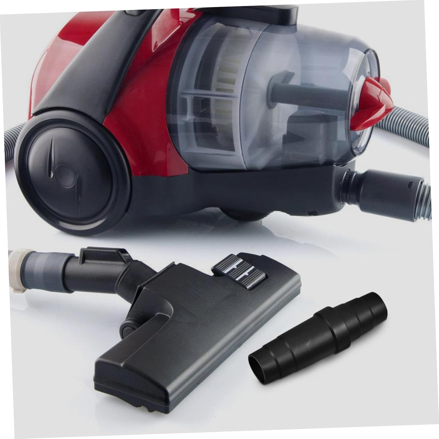 Cabilock Universal Vacuum Cleaner Adapter placed next to a vacuum cleaner and a floor nozzle, demonstrating its intended use.