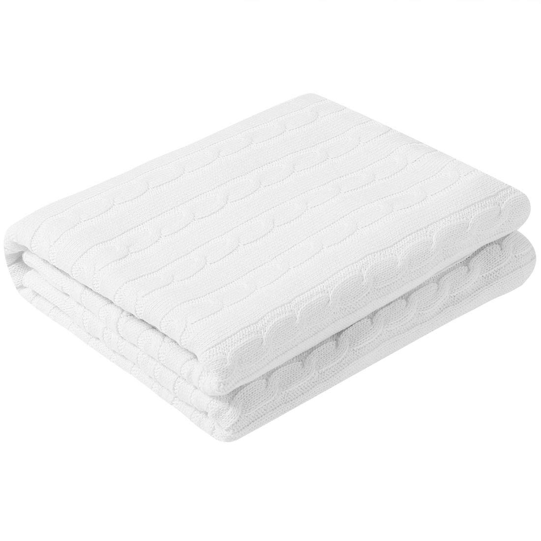 Couverture tricotée douce en coton pour vos soirées cocooning au salon