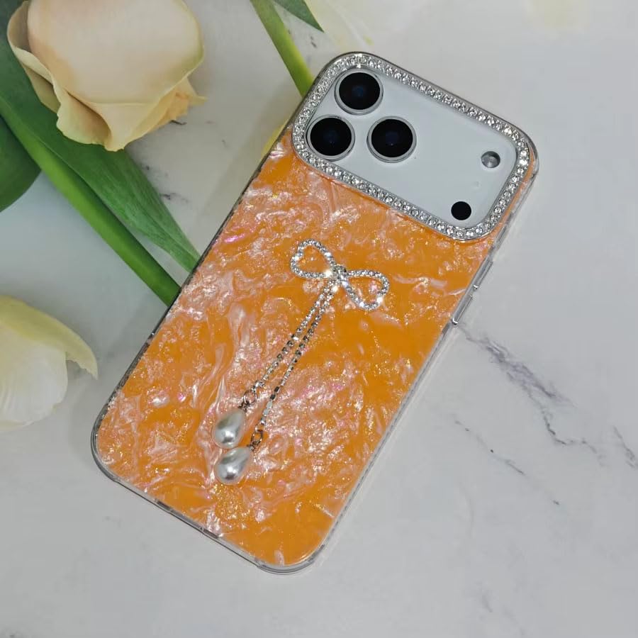 Image of mobistyle Designed with iPhone 17 Pro | Shell Pattern with Bow Tassel and Daimond Camera Lens Protection Back Cover Case for Women Girls iPhone 17 Pro (Orange)
