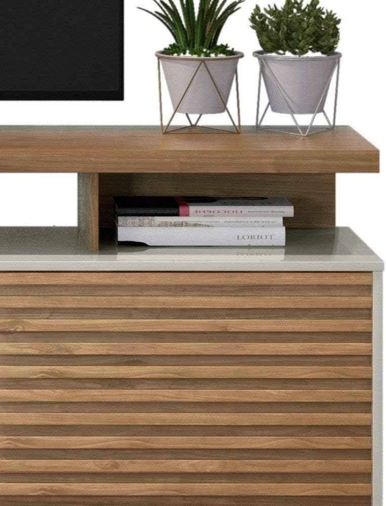 Close-up of the TV stand's open shelf and decorative elements