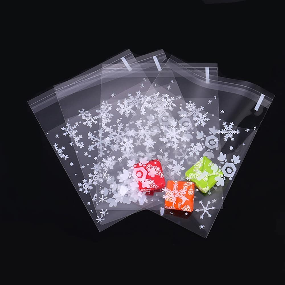YUNCHONGuk 100 Pcs Christmas Self Adhesive Cellophane Cookie Bag,Clear Cookie Bags,Plastic Sweet Bags,Snowflake Treat Bags,Party Favor Candy Bags for Christmas Party Favors Package Bags