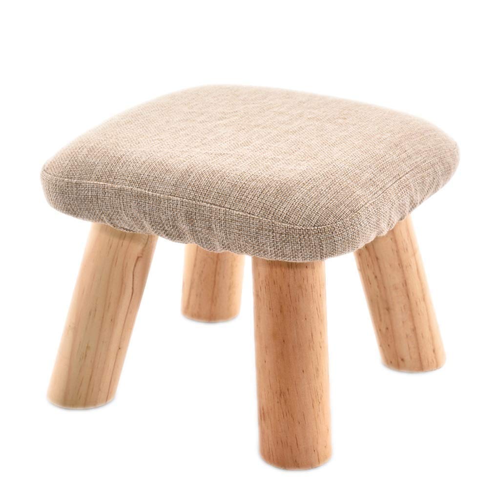 Pouf enfant beige pour créer un coin lecture cosy dans le salon
