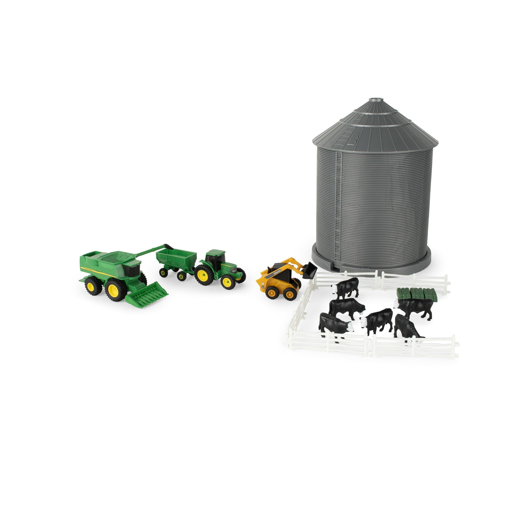 A young girl placing a toy tractor into the grain bin, demonstrating its use as a storage container.
