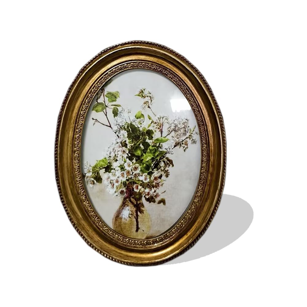 Cadre photo ovale vintage aux moulures dorées et finitions d'art
