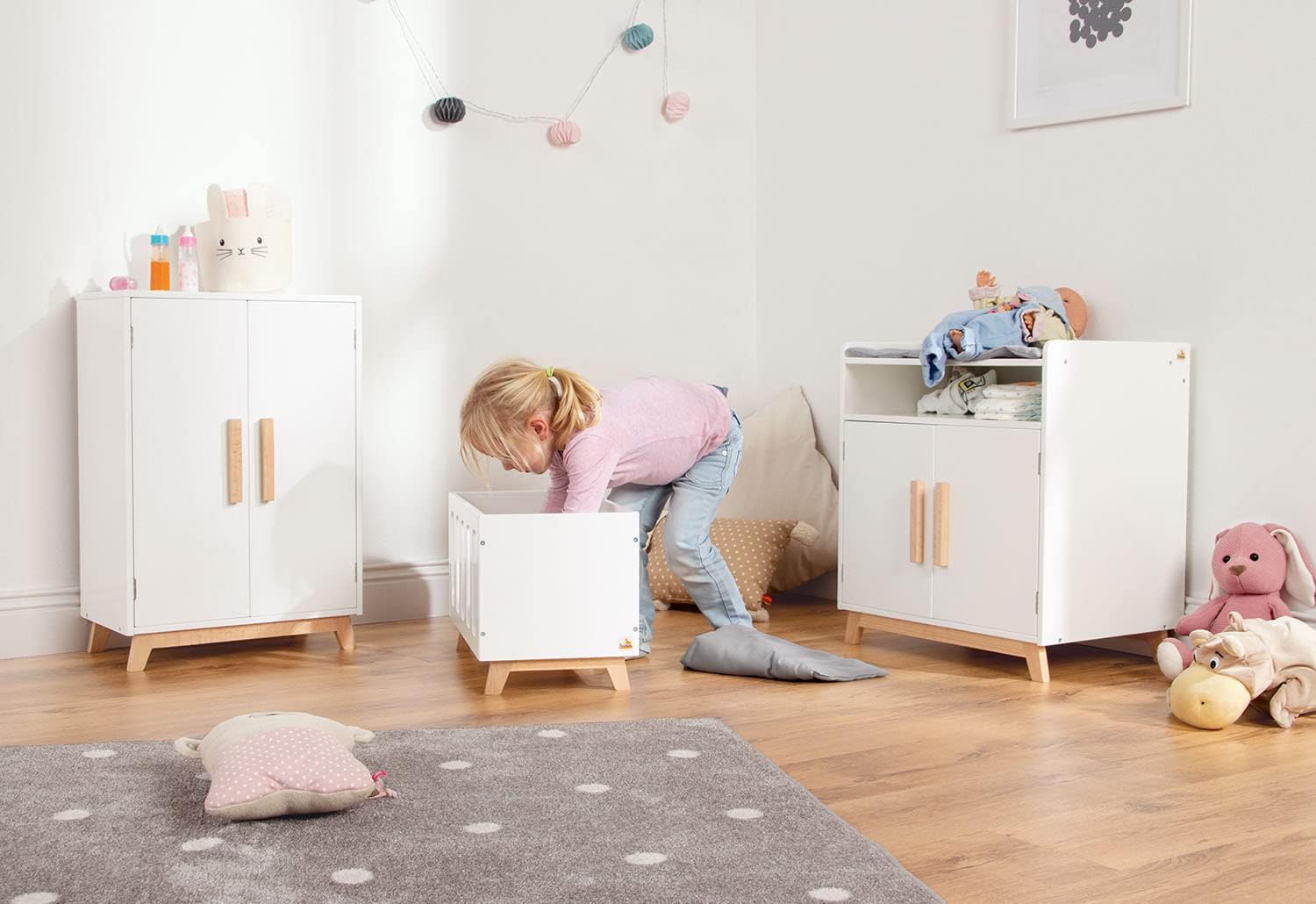 Child playing with Pinolino Marit Doll Changing Table and matching furniture
