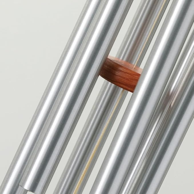 With its timeless sound and quality craftsmanship, the Woodstock Wind Chimes Original Amazing Grace Chime is a beloved choice for those looking to enhance their outdoor living space with a touch of tranquility and beauty. Whether you are enjoying a quiet moment alone or hosting a gathering with friends and family, this wind chime is sure to bring a sense of peace and serenity to your outdoor environment. Description by ChatGPT.