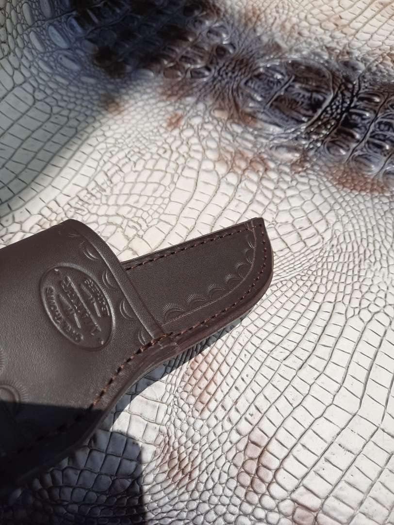 Custom Cross Draw Knife Sheath for Buck 102 Knife. The Sheath Is Made Out of 10 Ounce Water Buffalo Hide Leather the Leather Is Soft Pliable and Very Durable. This Sheath Can Be Worn on the Right or Left Hand Side. It Is Died Dark Brown with Border Tooling. This Is for Sheath Only Knife Not Included.