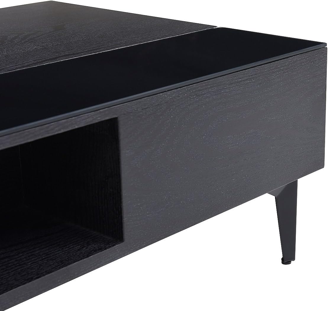 Iš arti view of the open storage niche and the black glass accent on the SIDELIA coffee table.