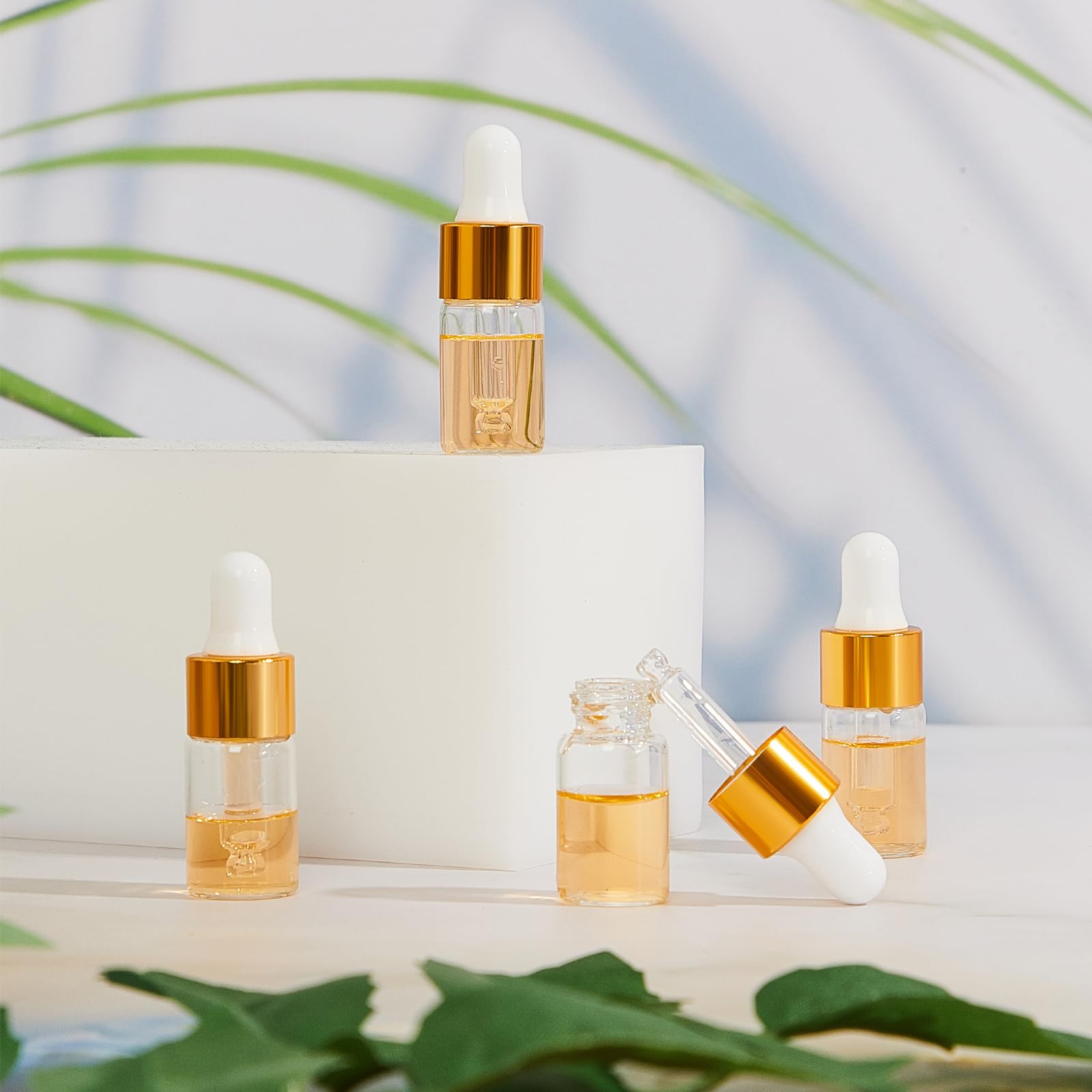 Didaey 200 mini botellas cuentagotas de vidrio, mini botellas cuentagotas de muestra, viales pequeños de muestra con tapa para viajes, aceites esenciales, perfume de muestra líquida cosmética