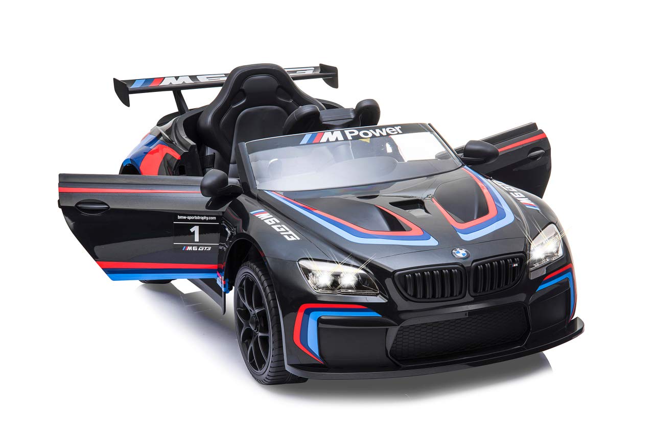 JAMARA 460474 – Ride-on BMW M6 GT3 – potenti motori di azionamento e batteria per lungo tempo di guida, 3 marce, ammortizzatore, connettore AUX, anello in gomma ultra grip, faro LED, nero, grande