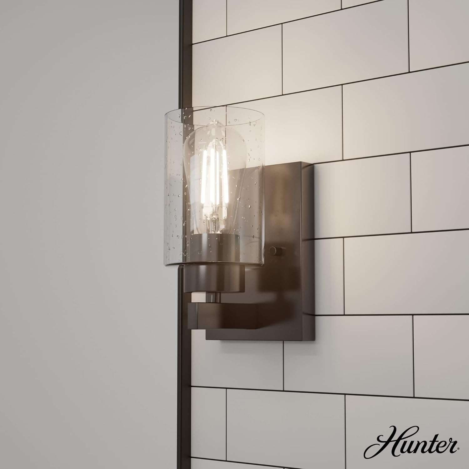 Noble Bronze Dimmable Metal Wall Sconce with Seeded Glass Shade