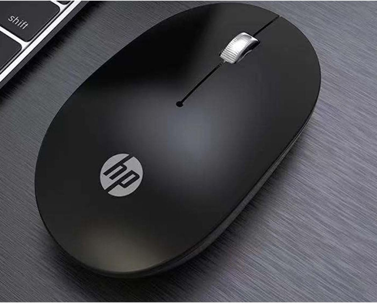 HP Wireless Mouse S1500 on a desk next to a keyboard.