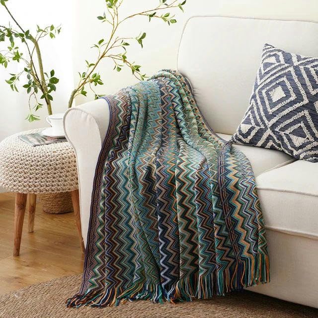 Couverture bohème en tricot douce et chaude avec grands pompons