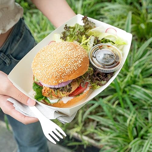 Vista 229 de Restaurantware Papel de periódico Bio Boat - 3" x 2" x 1" - Caja de 50 unidades Newsprint