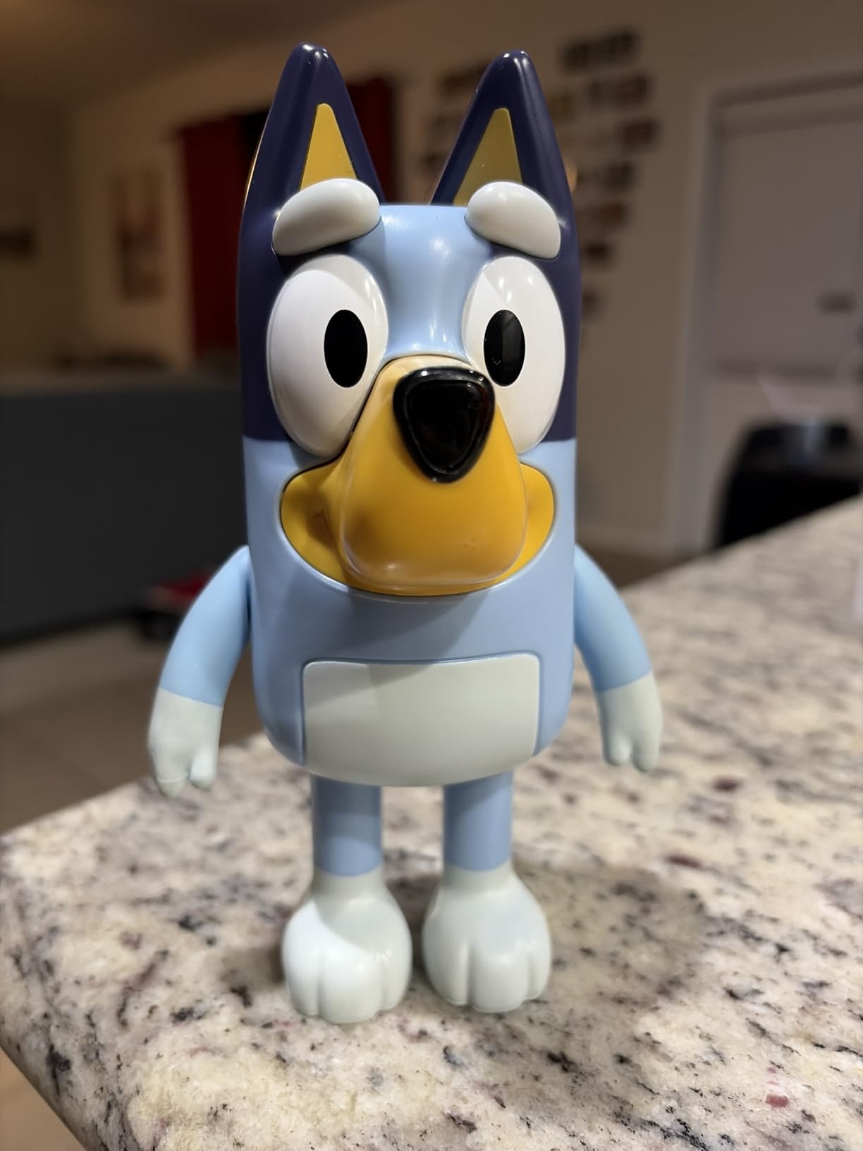 Child playing with Bluey Electronic Figure