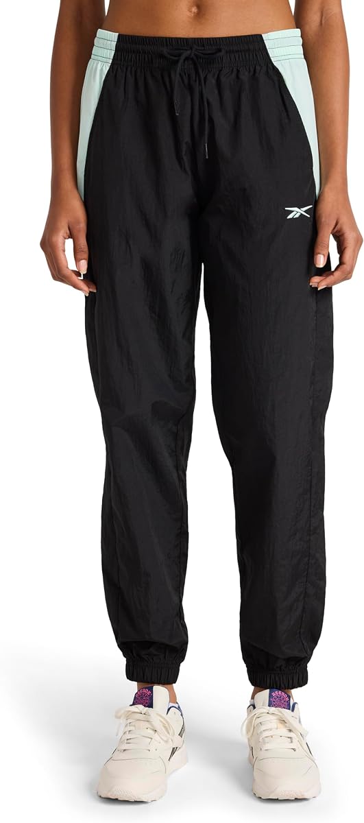 Reebok Pantalón tejido Bv para mujer, ajuste estándar, entrepierna de 29 pulgadas, tejido ligero de nailon arrugado