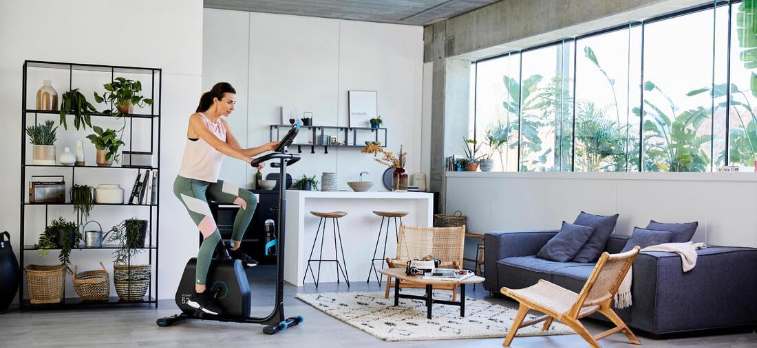Woman exercising on Domyos EB520 in a living room