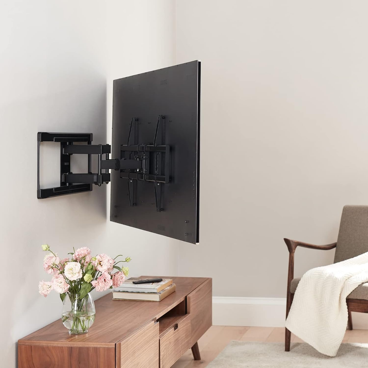 onn. Full Motion TV Wall Mount installed with a television