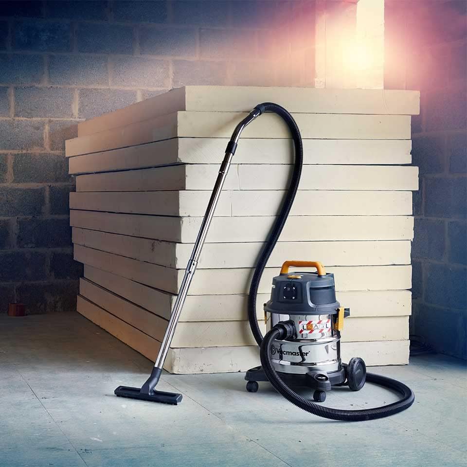 Hand adjusting the filter bag inside the Vacmaster VK1620SWC.