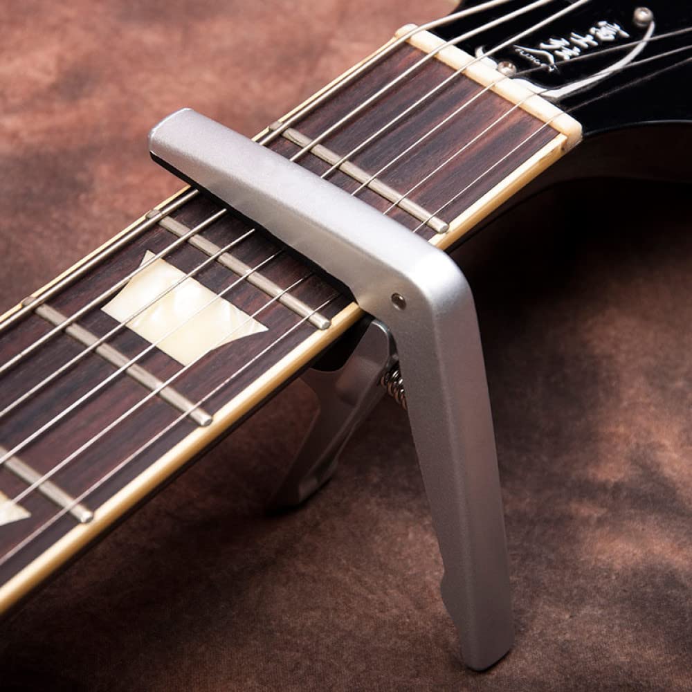 ABS plastikowy zacisk gitarowy Capo, z kostkami, na 6 gitar strunowych Folk Pop Wood części do gitary akcesoria, czarny (srebrny)