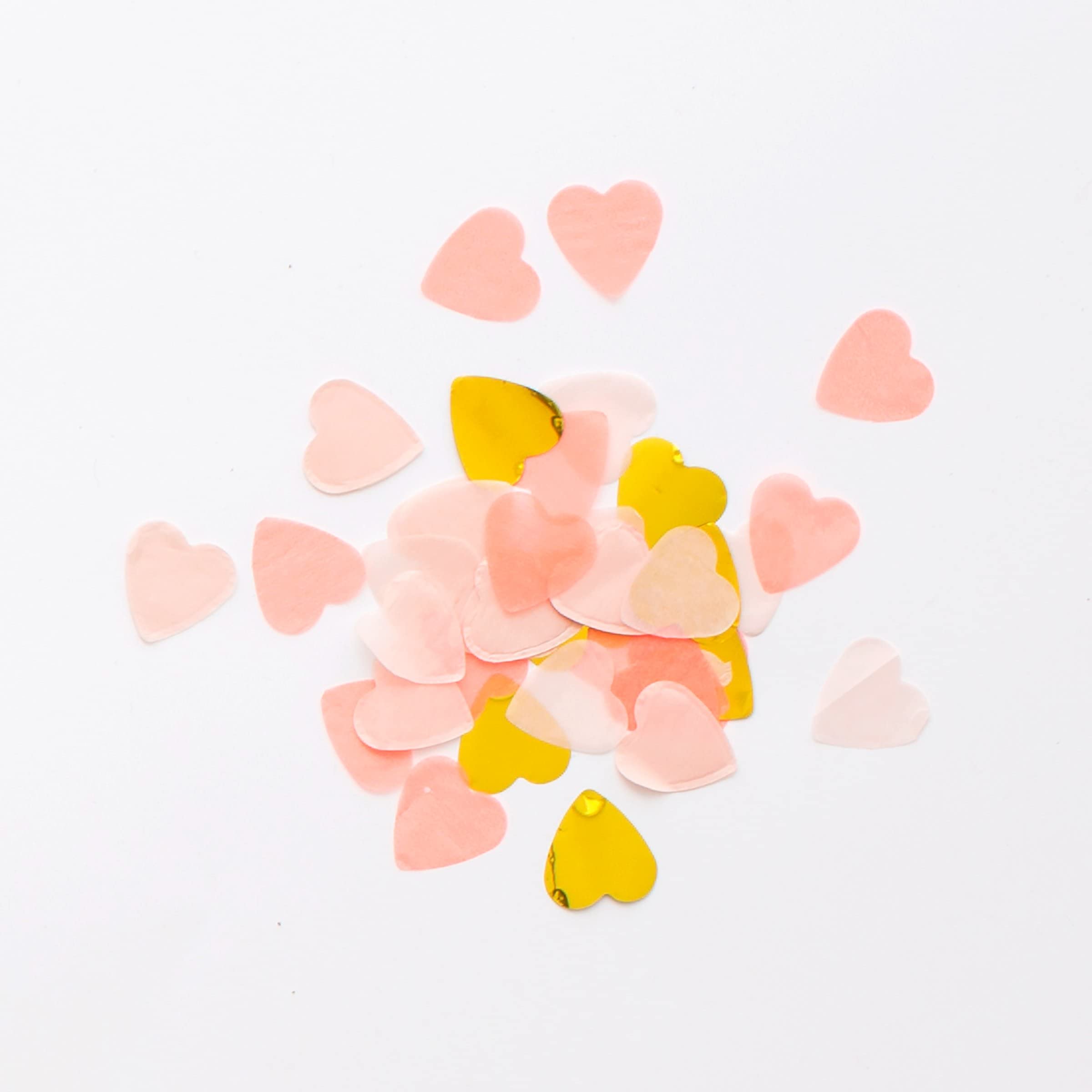 Cœur à confettis en rose et or pour surprendre vos invités