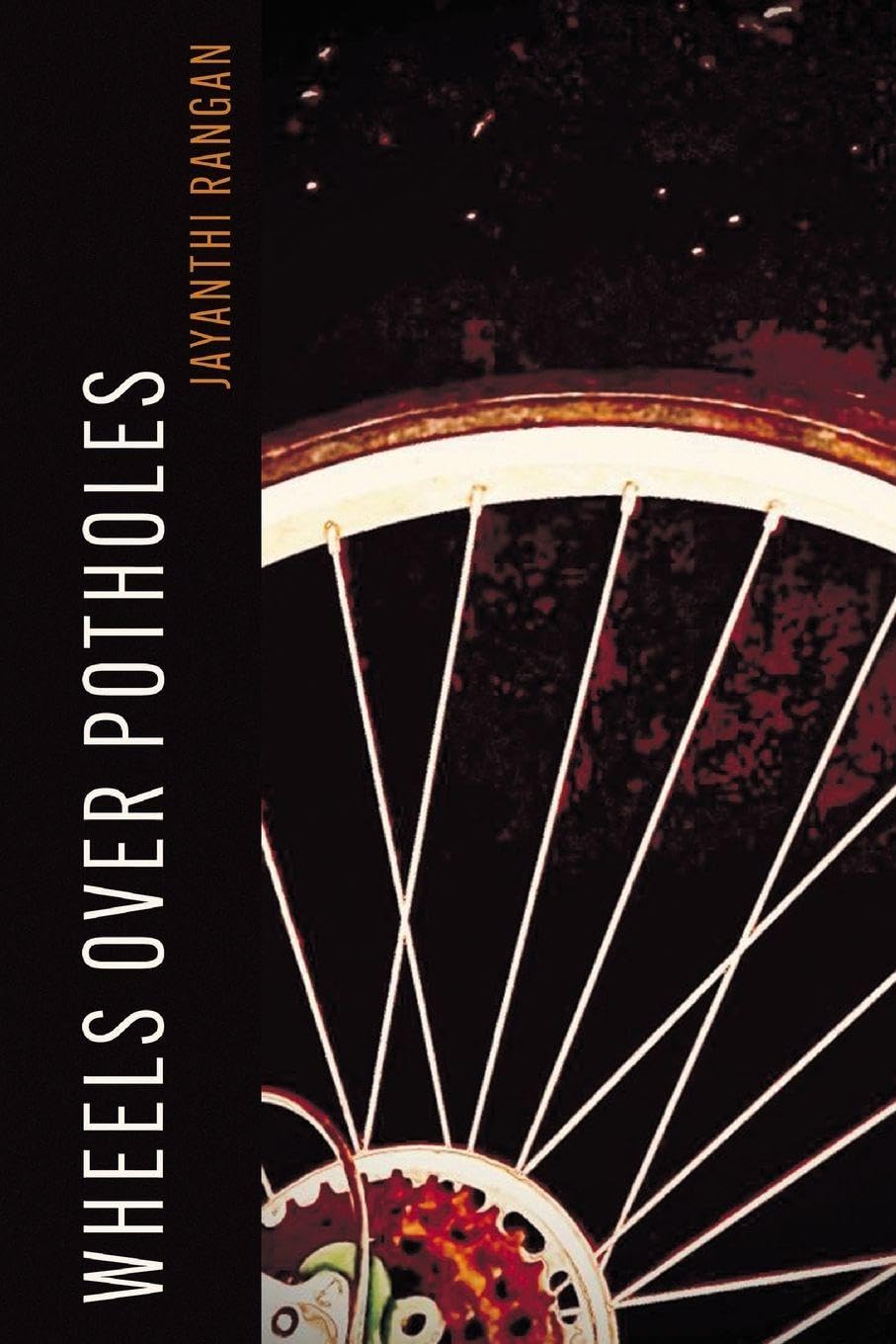 Wheels over Potholes      Paperback – February 27, 2026