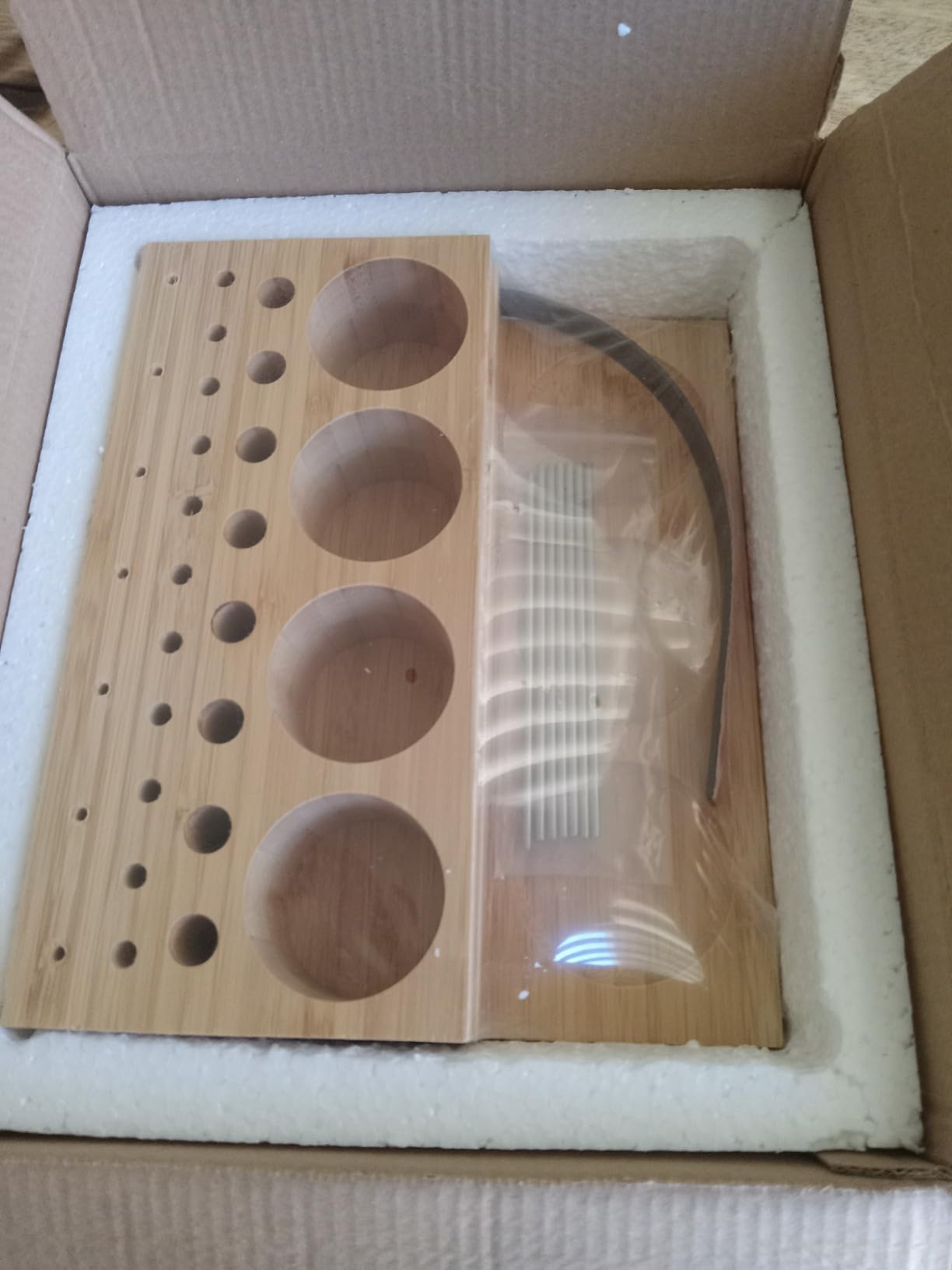 Raprance wooden caddy holding fly tying bobbins, scissors, and tools