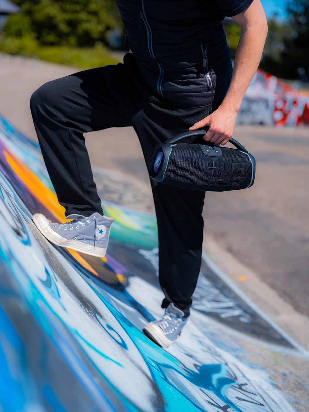 N-Gear NRG 200 speaker held by a person, showing its portable size