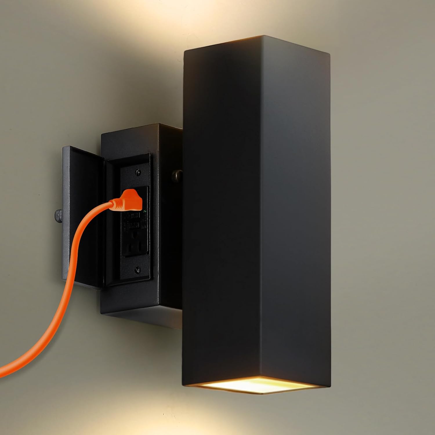 black porch light with outlet mounted by a doorway