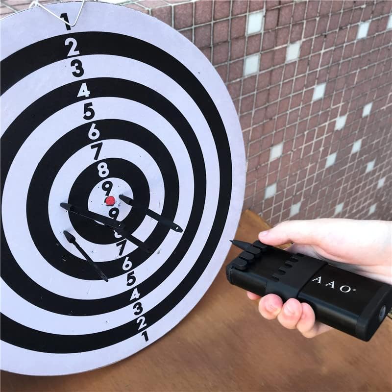 Person holding dart launcher aiming at target