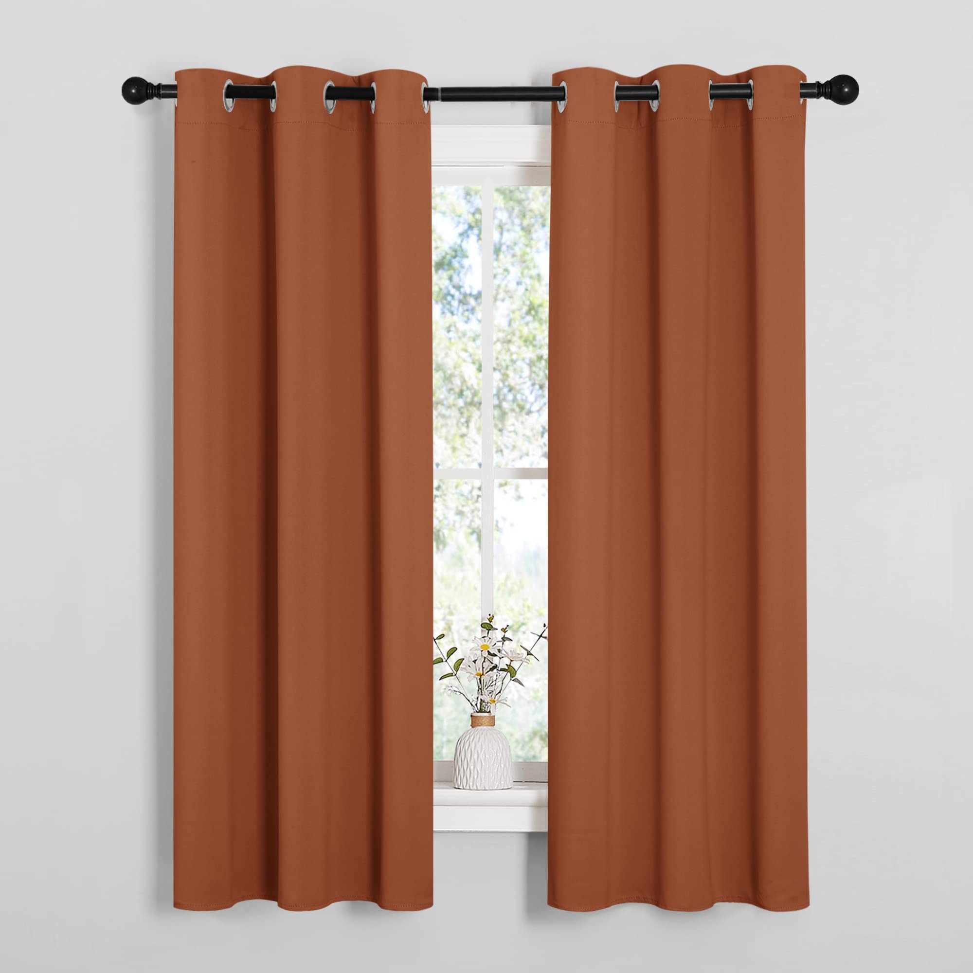 NICETOWN Blackout Curtain Panels for Girls Room, Nursery Essential Thermal Insulated Solid Grommet Top Blackout Drapes (Burnt Orange, 1 Pair, 34 x 63 Inch)