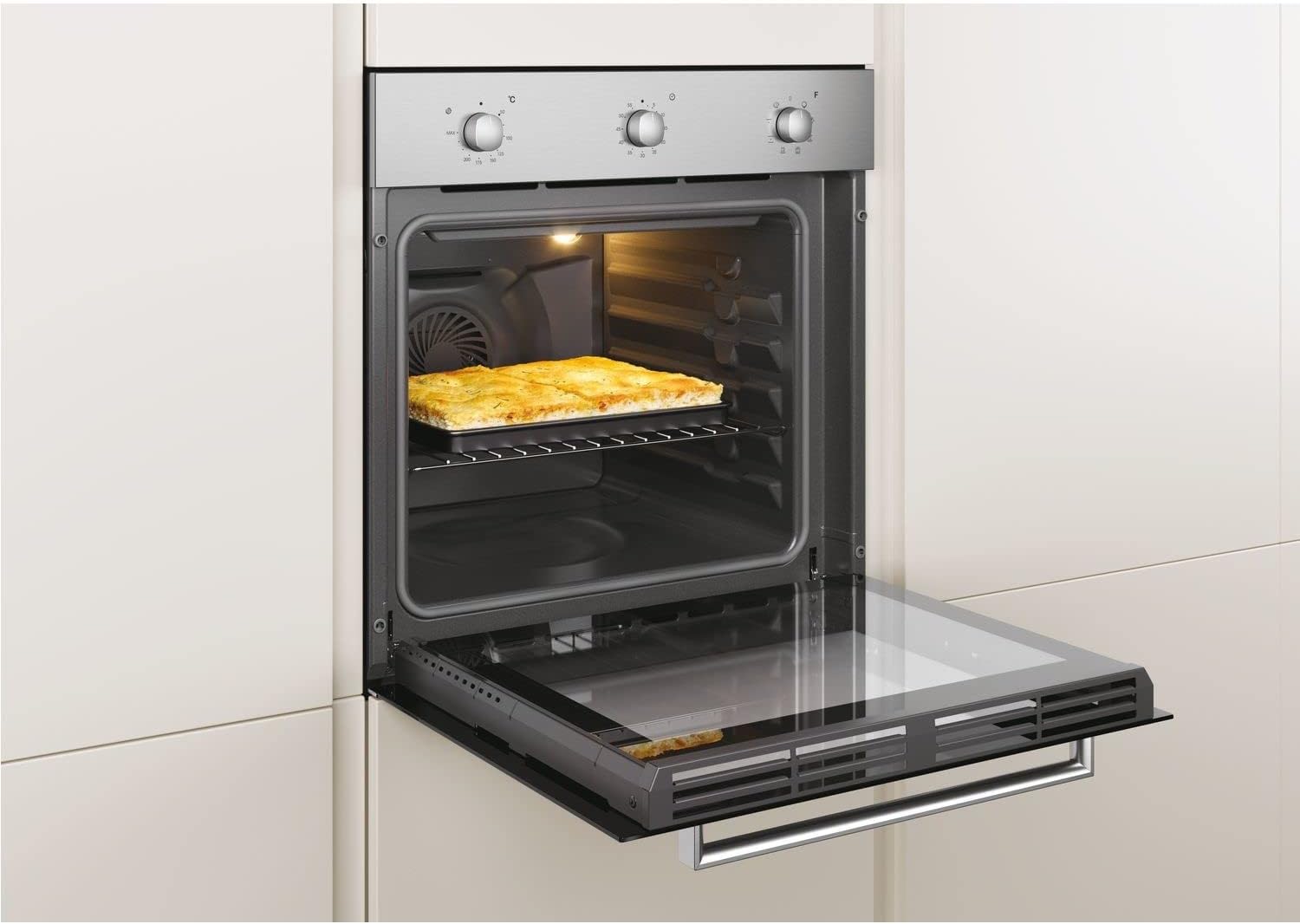 Oven with door partially open, showing a dish baking inside