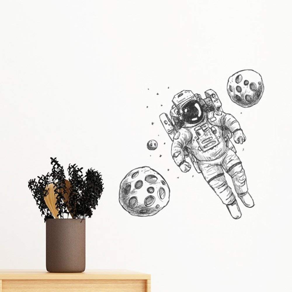 Sticker mural astronaute amovible univers et monstre de 35cm