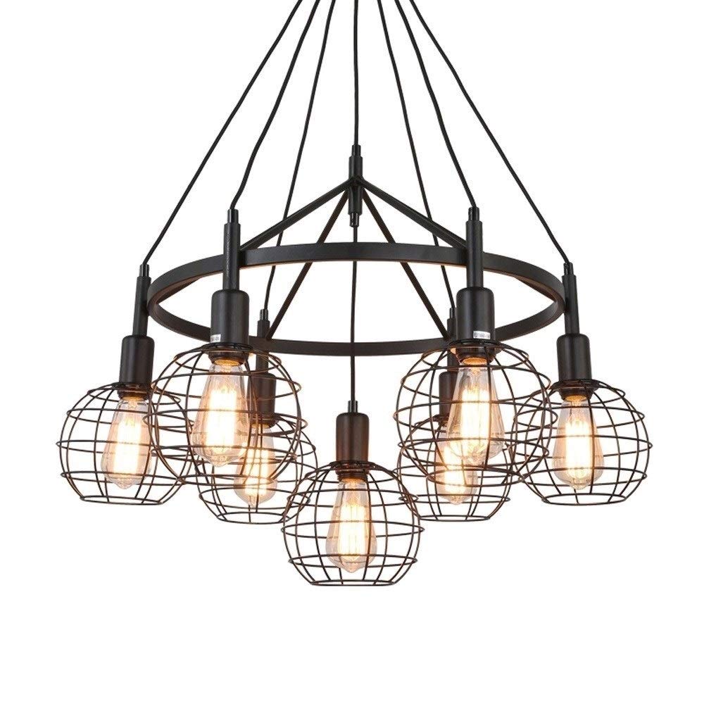Lampe suspendue vintage en fer forgé pour éclairer une table de cuisine sombre