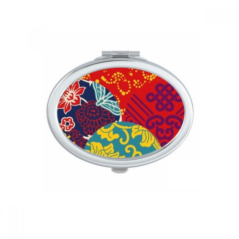 Miroir de poche ovale avec motif floral et noeud chinois