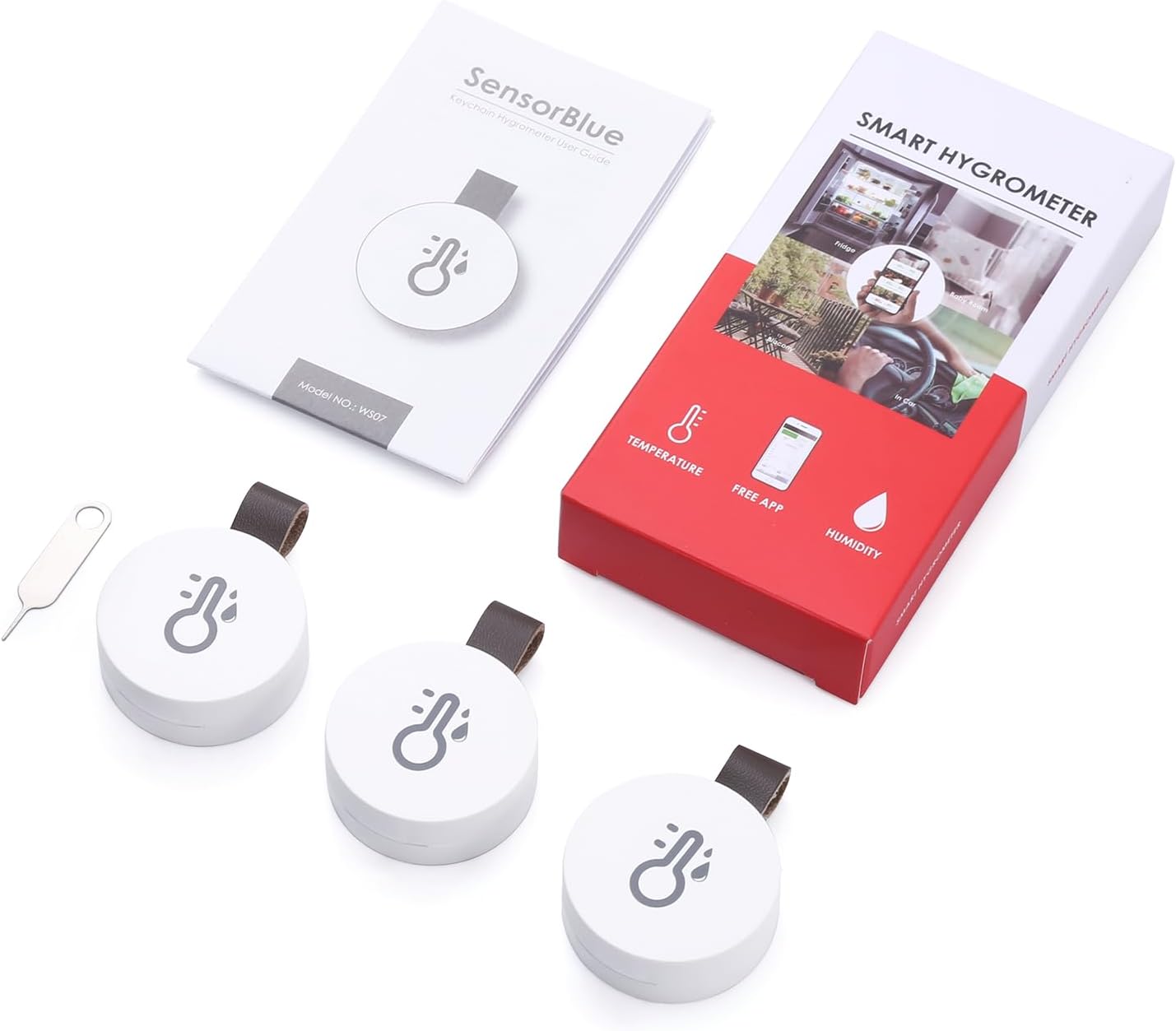 Product packaging and contents, including two sensors, an instruction manual, and a tool for battery access.