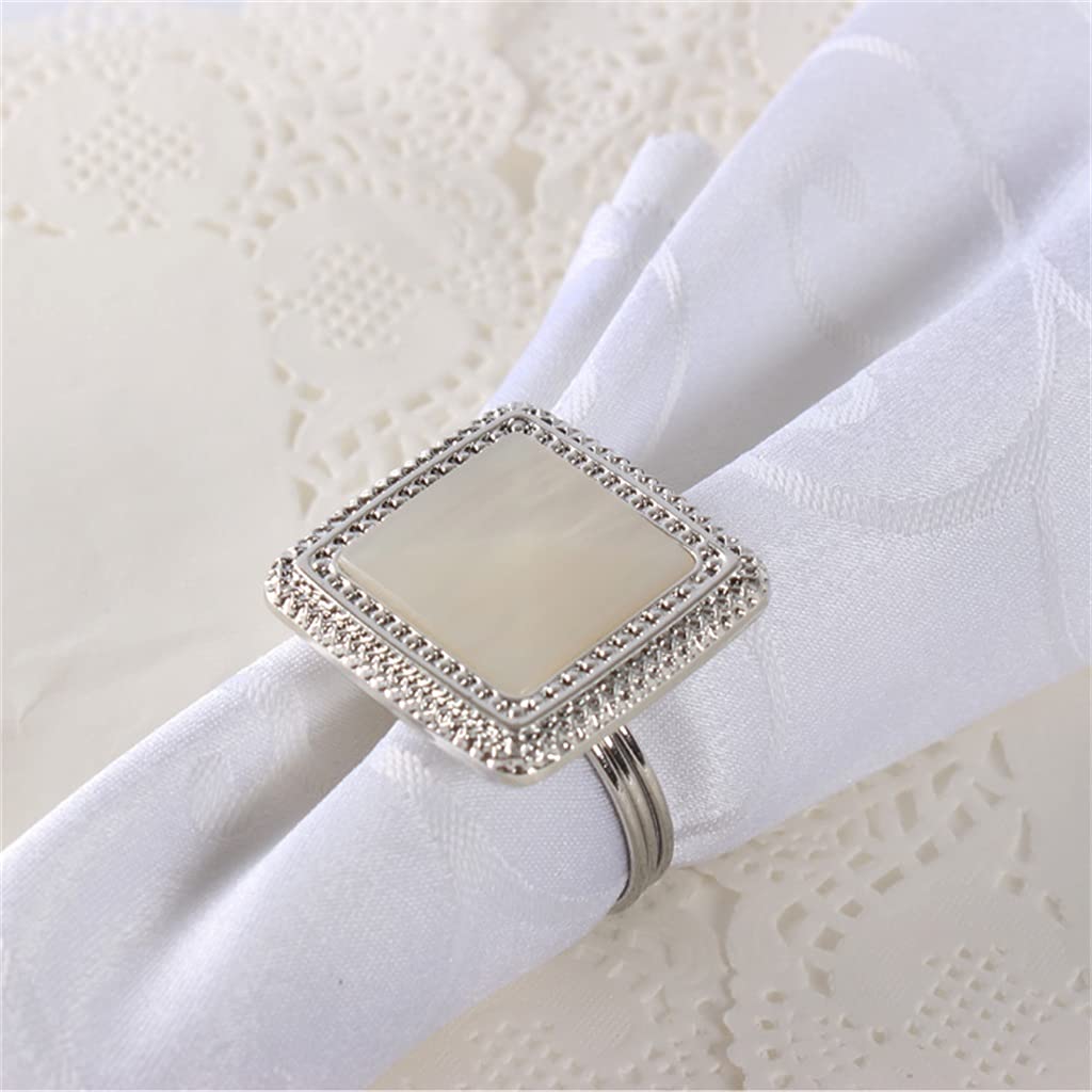 Lot de 10 ronds de serviette argentés pour banquet de mariage à l'hôtel.