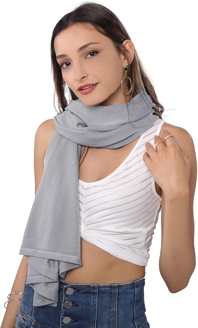 The MissShorthair Women's Lightweight Knitted Scarf Poncho comes in a range of classic and fashionable colors, allowing you to choose the perfect shade to complement your wardrobe. Whether you're heading out for a coffee date, running errands, or attending a special event, this poncho offers versatility and style to keep you warm and chic throughout the season. Description by ChatGPT.