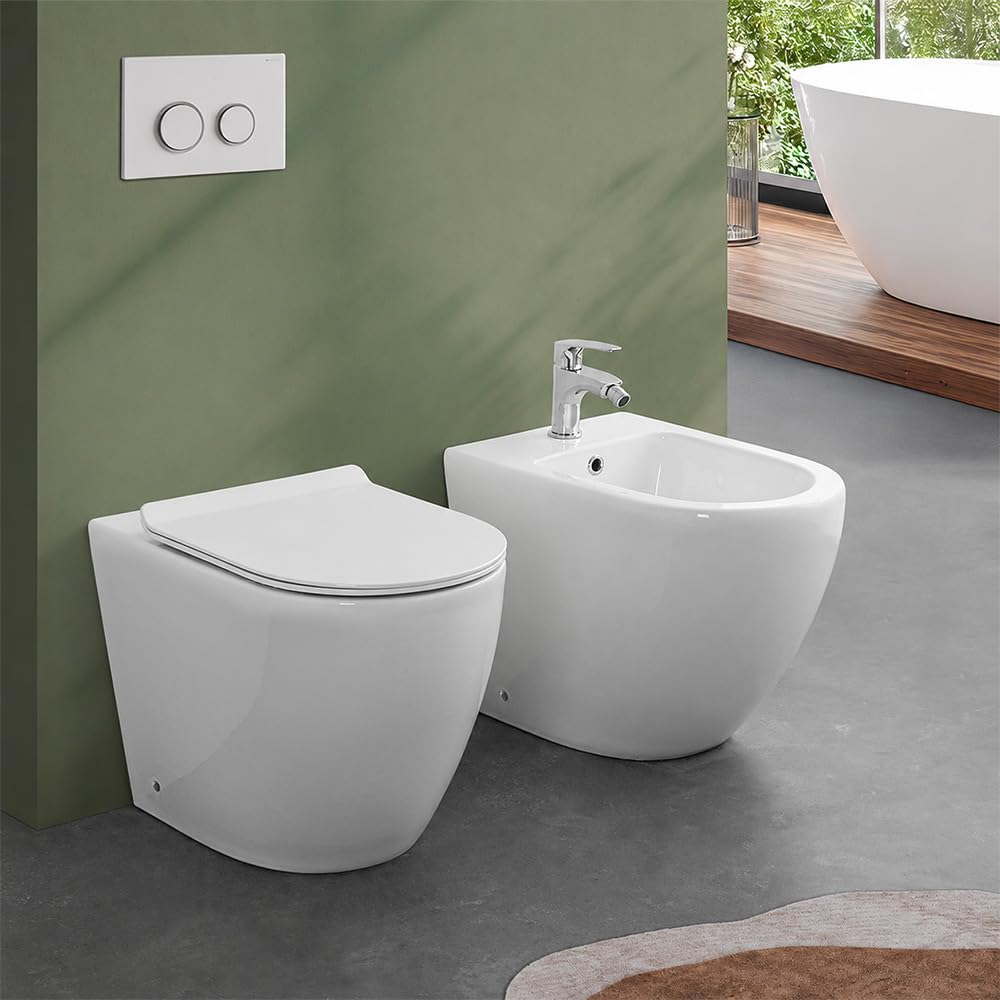 Sanitari filomuro in ceramica bianco lucido con brida e scarico traslato a parete o pavimento, sedile originale soft-close con sgancio rapido, linea FLAN