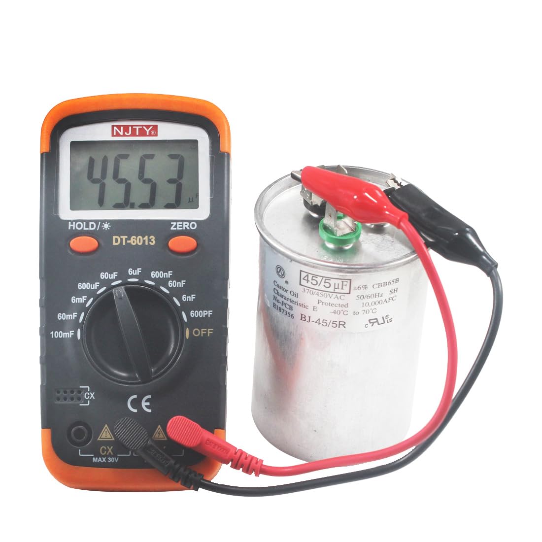 Luo ke DT-6013 Digital Capacitor Meter measuring a large capacitor