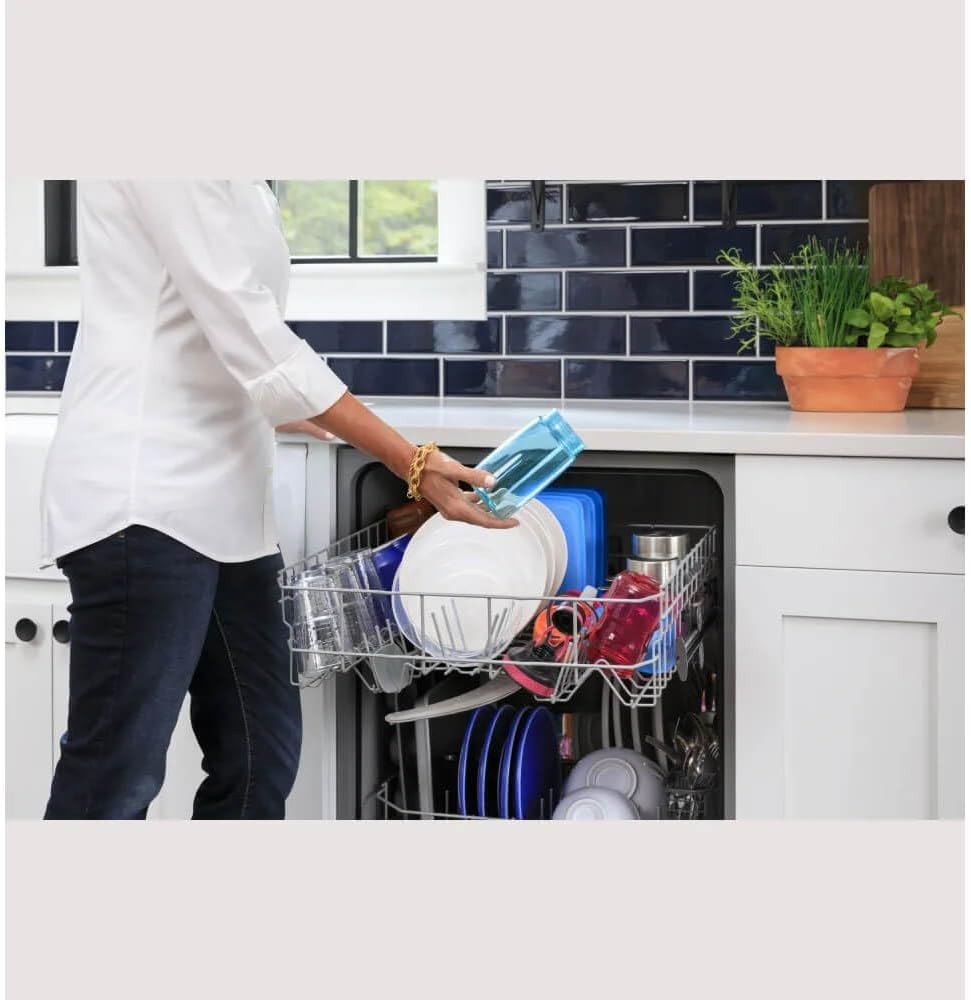 Person loading the top rack of the GE dishwasher
