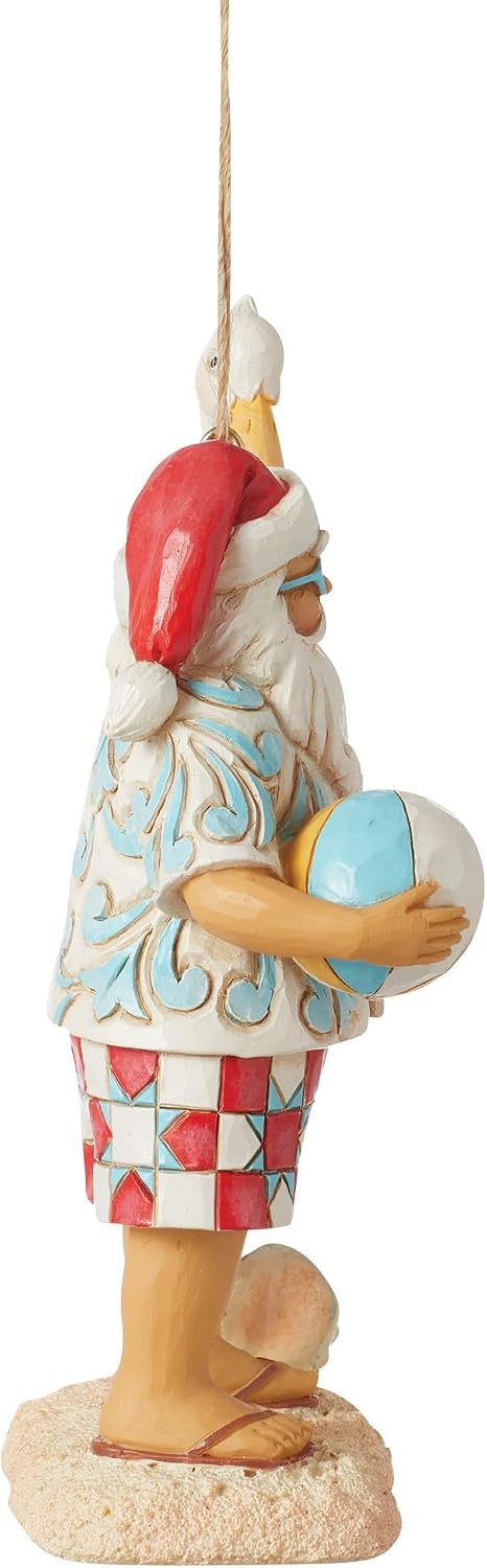 Enesco Jim Shore Heartwood Creek Coastal Santa with Beach Signs and Pelican Hanging Ornament- Stone Resin Hand Painted Crafted Collectible Santa Christmas Tree Ornaments Home Decor, 4.72 Inch