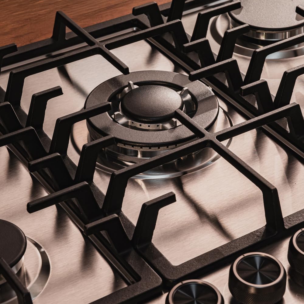 Close-up of the control knobs on the gas hob