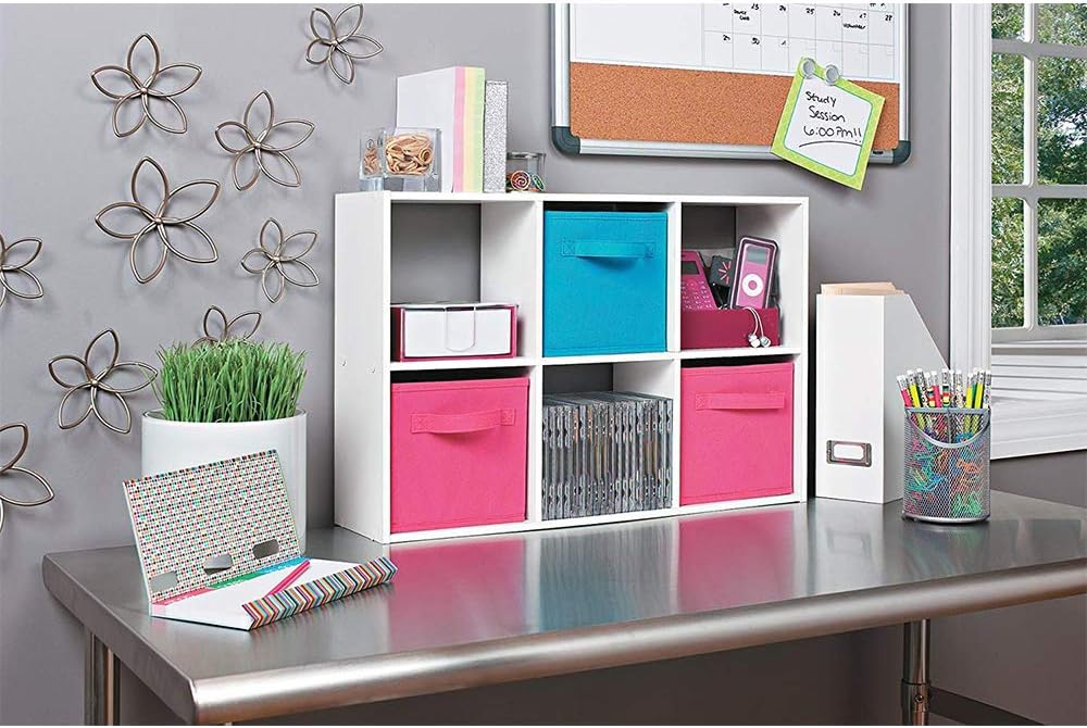 White 6-cube organizer on a metallic table, filled with fabric bins, CDs, and other small items.