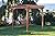 A&L Furniture Co. 8' x 8' Amish-Made Cedar Pergola with 6' Royal English Porch Swing, Walnut