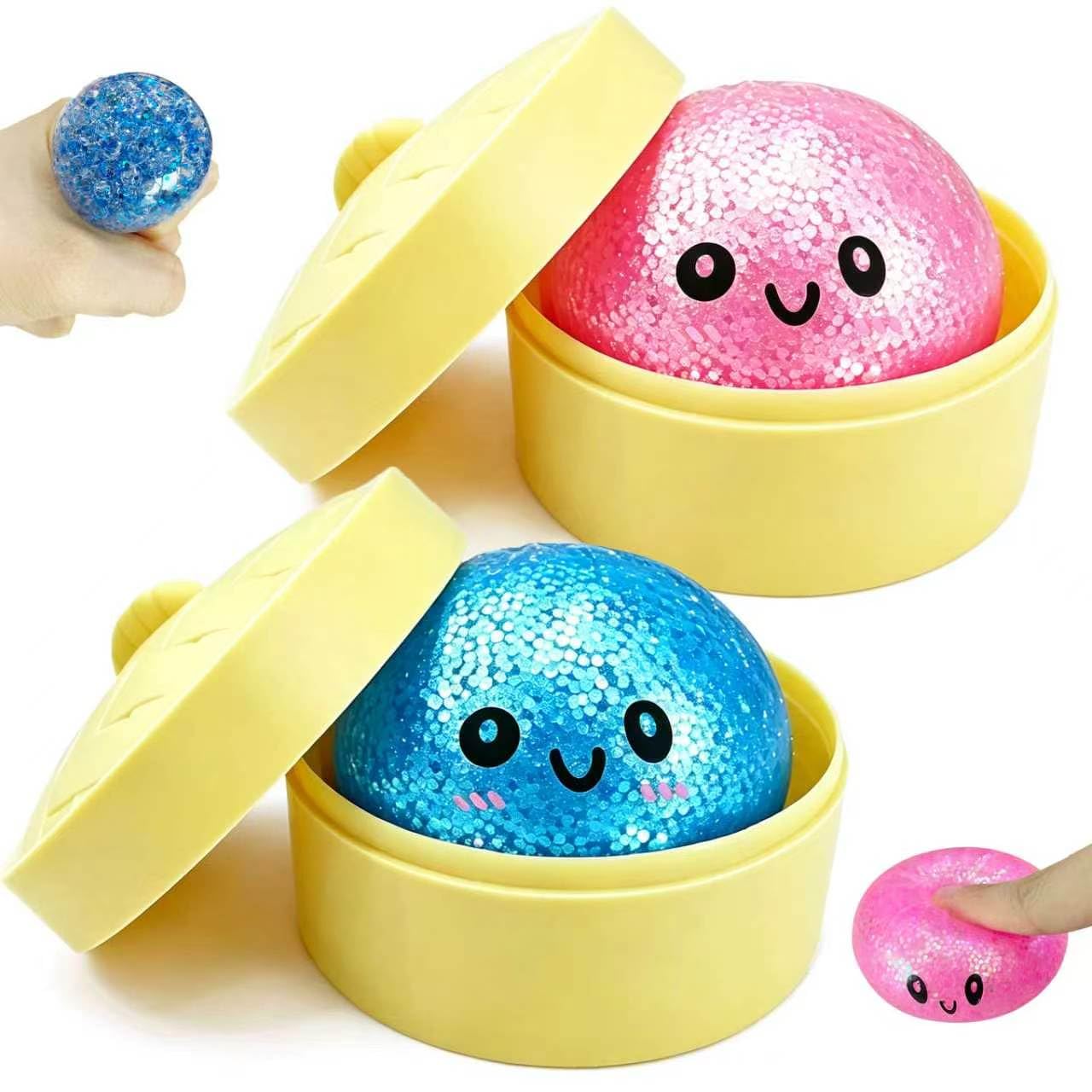 Photo 1 of 2 Pack Mini Dumpling Squishy Fidget Toys, Glitter & Bead Filled Stress Balls, Soft Slow Rising TPR Smiley Squeeze Toy, Tear-Resistant Sensory Toy for Stress Relief, Party Favors (Pink & Blue)